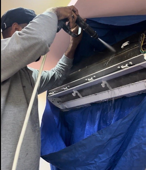 Split A/C technician troubleshooting internal components