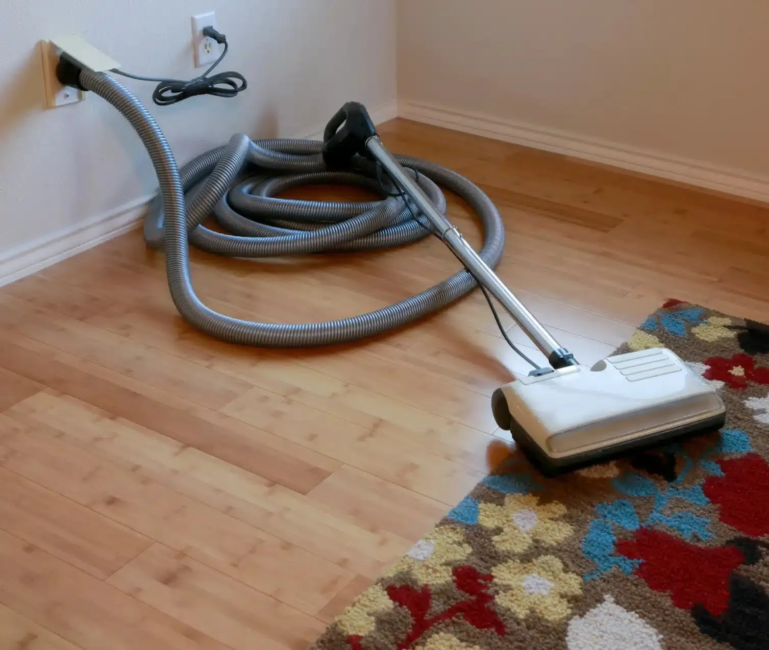 Central vacuum piping and concealed inlet services inside a wall